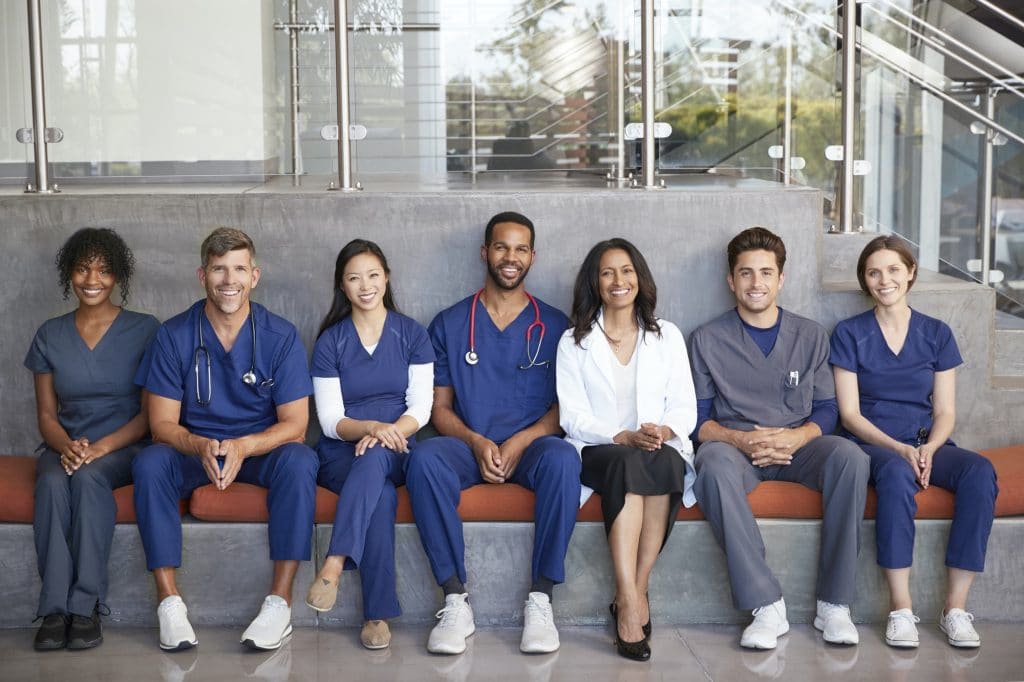 Healthcare workers sitting together in a modern hospital