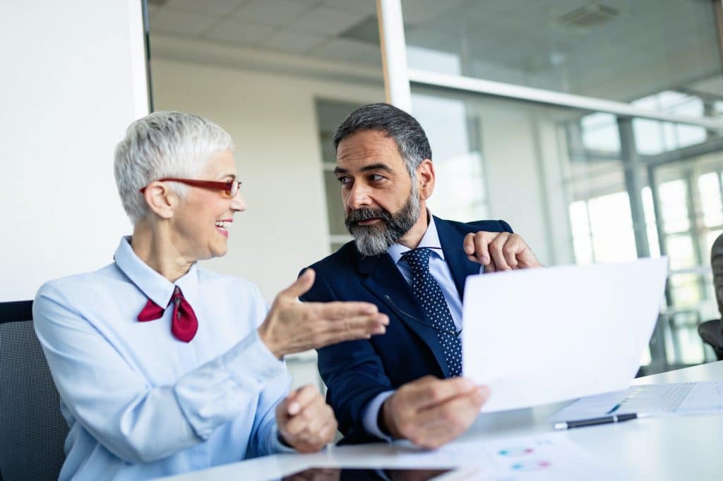 Senior business accountants working together at modern office