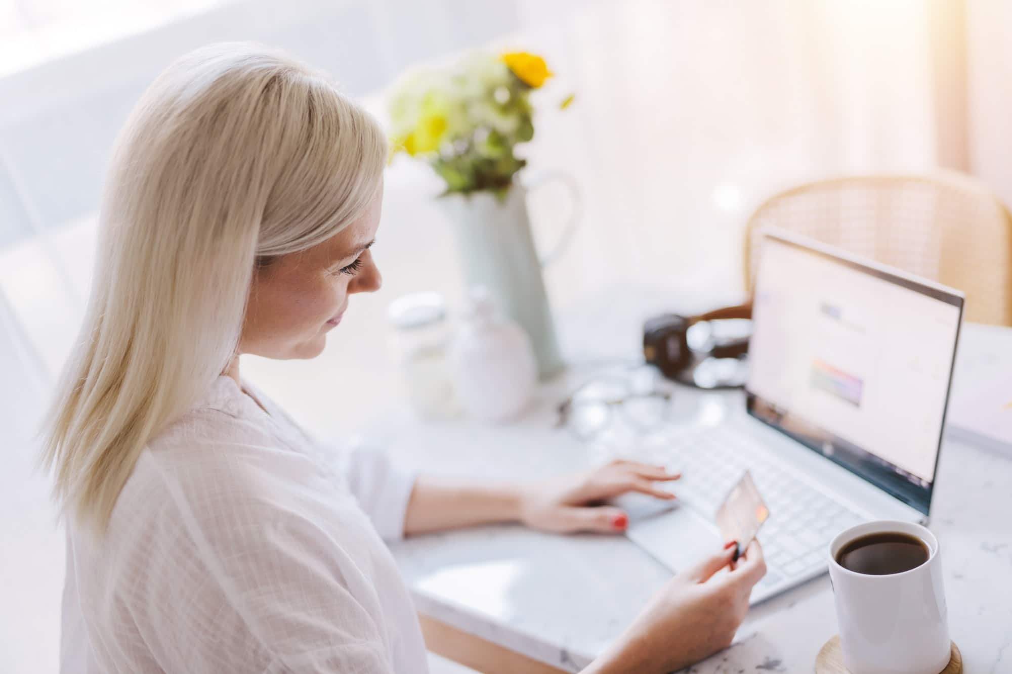 Woman paying online with her credit card.