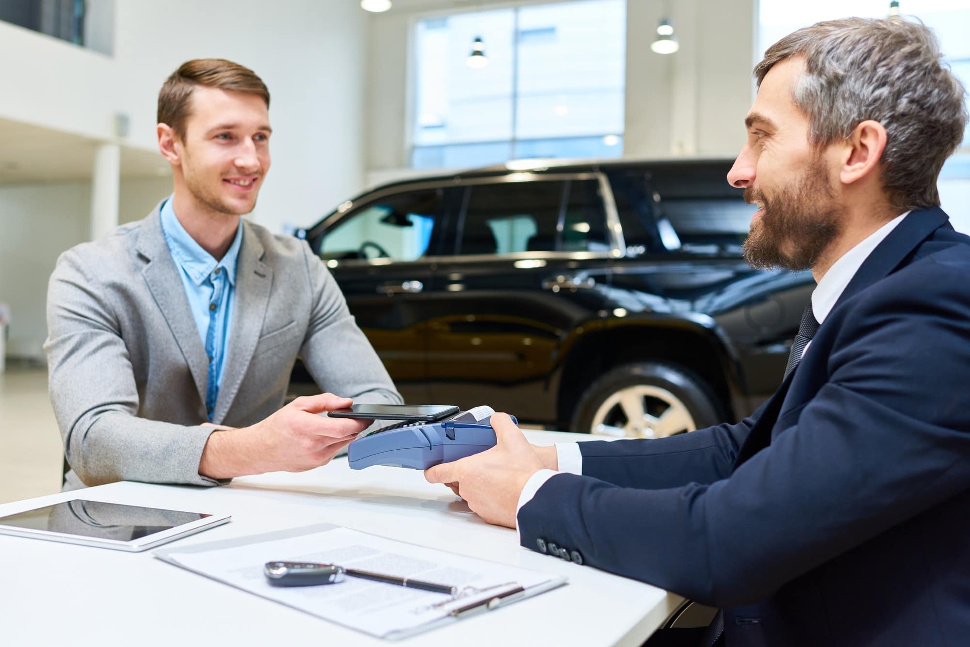 Young Man Buying Luxury Car