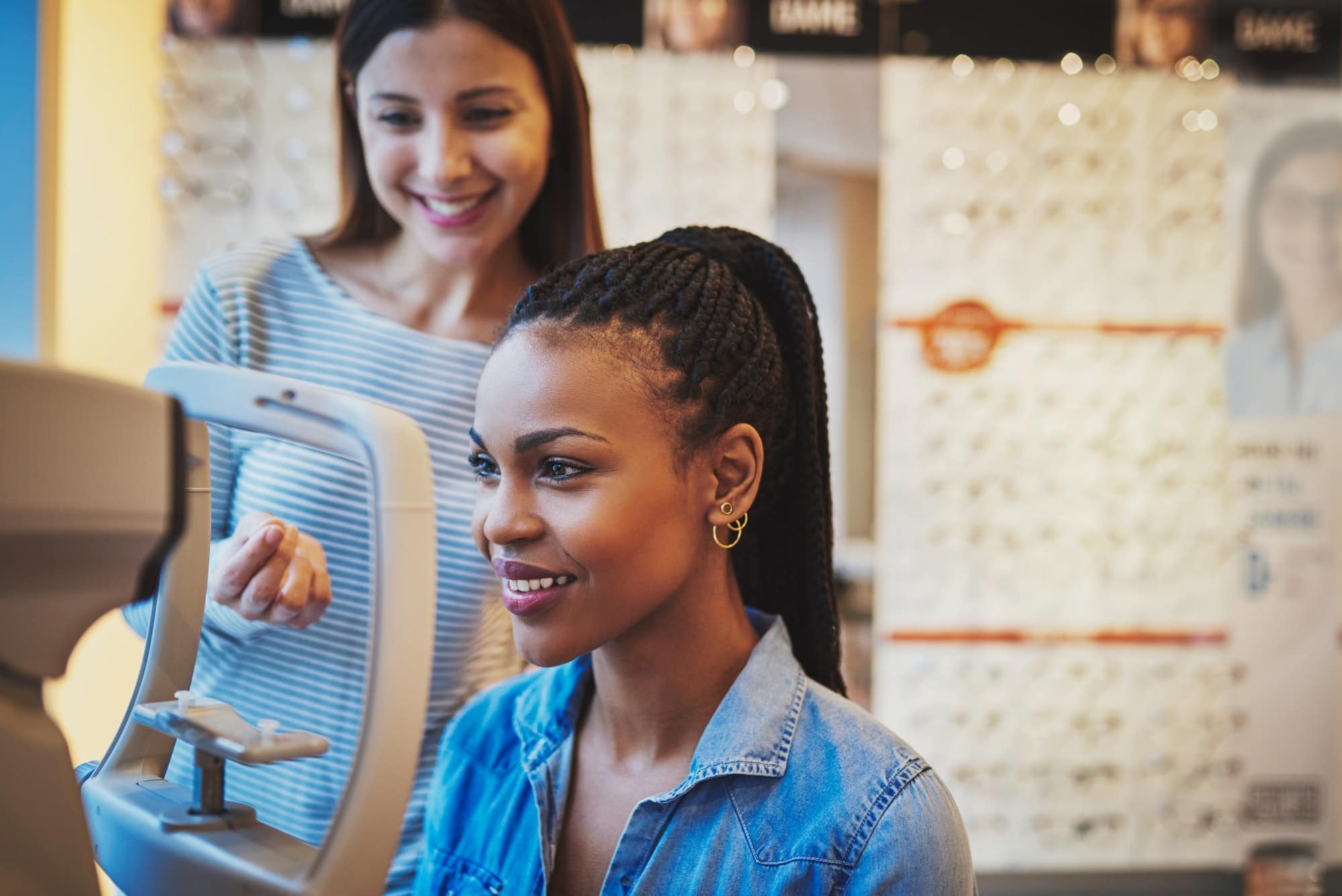 Smiling young black woman ready to take eye exam