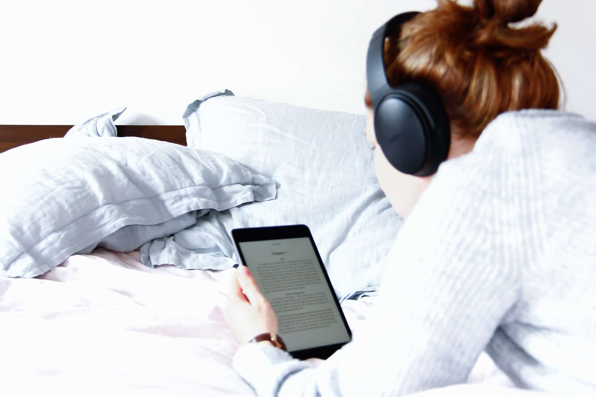 Woman reading kindle in bed