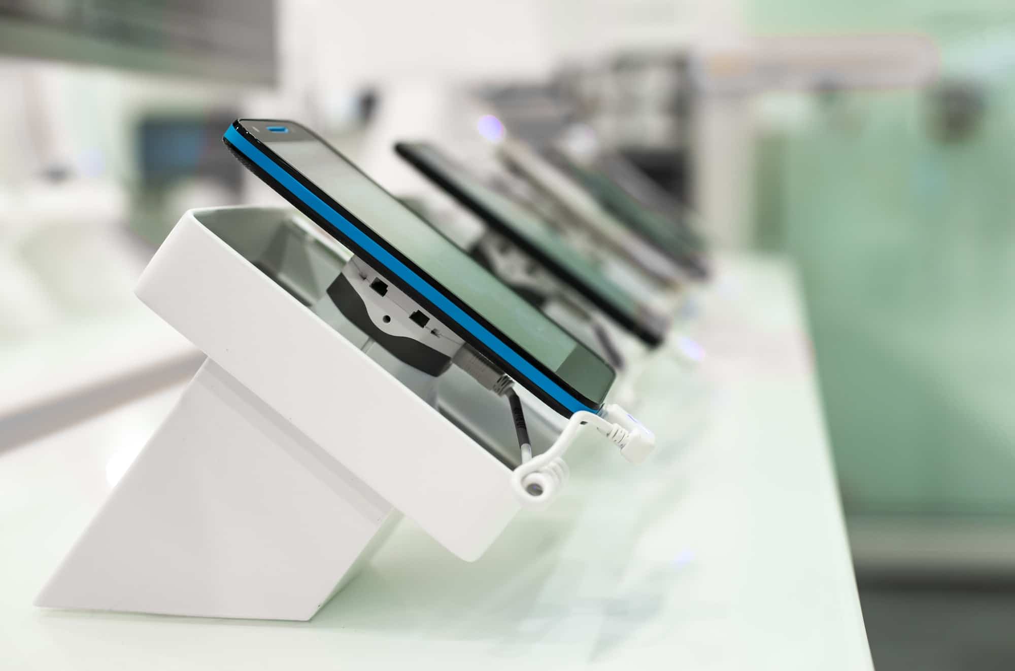 Smartphones on shelf in the store. Concept for communications an