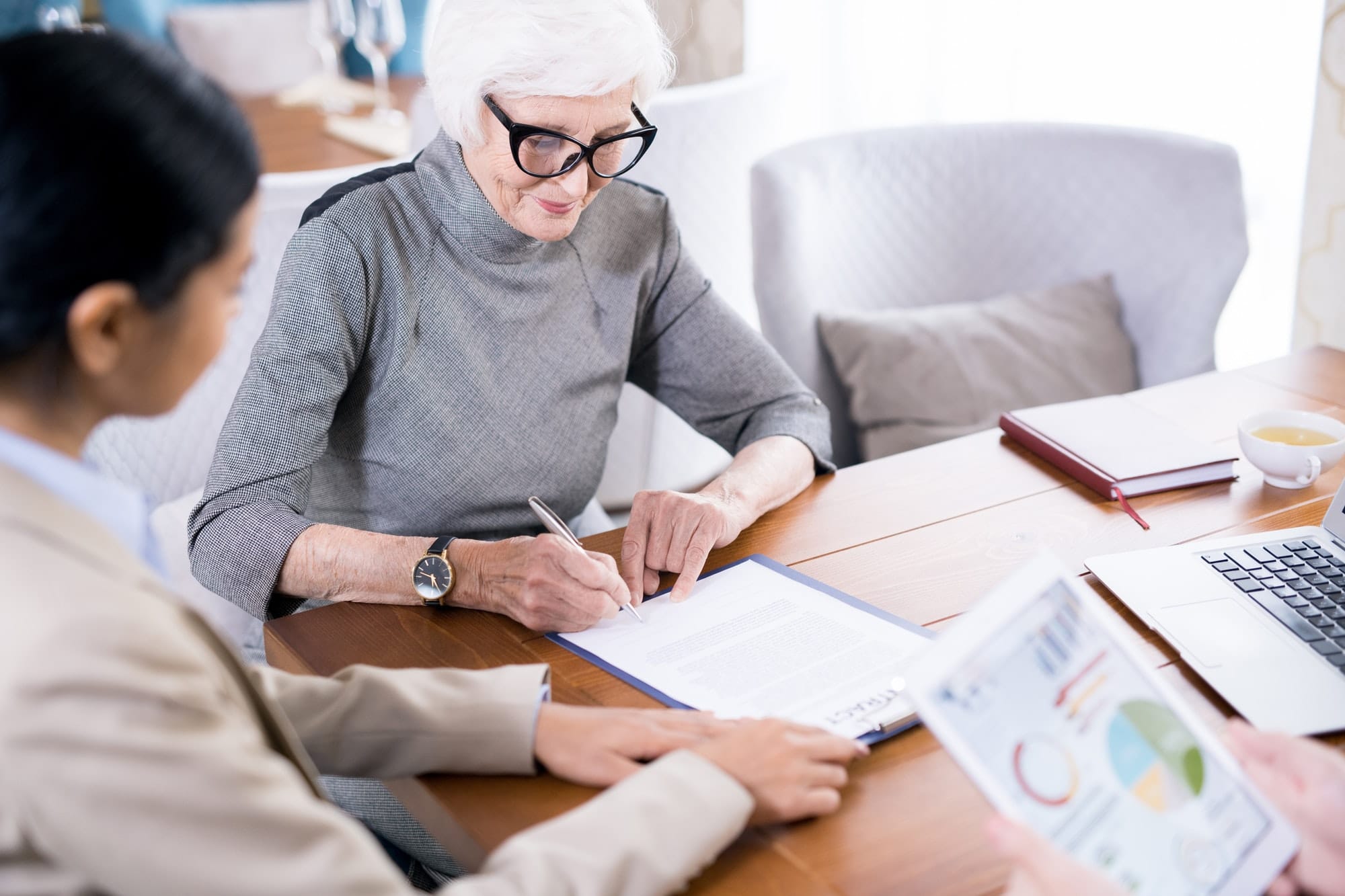 Senior woman writing testament