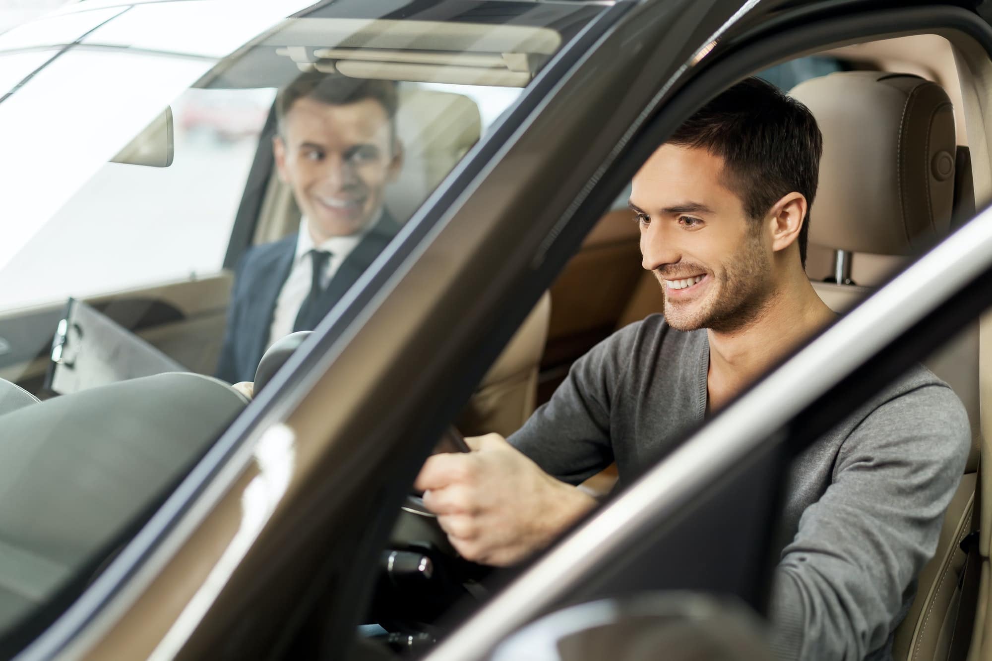 First test drive. Handsome young man ready to make first test drive