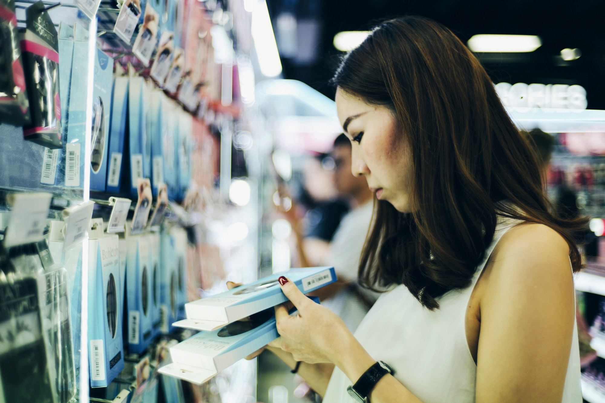 A woman shopping for cosmetics