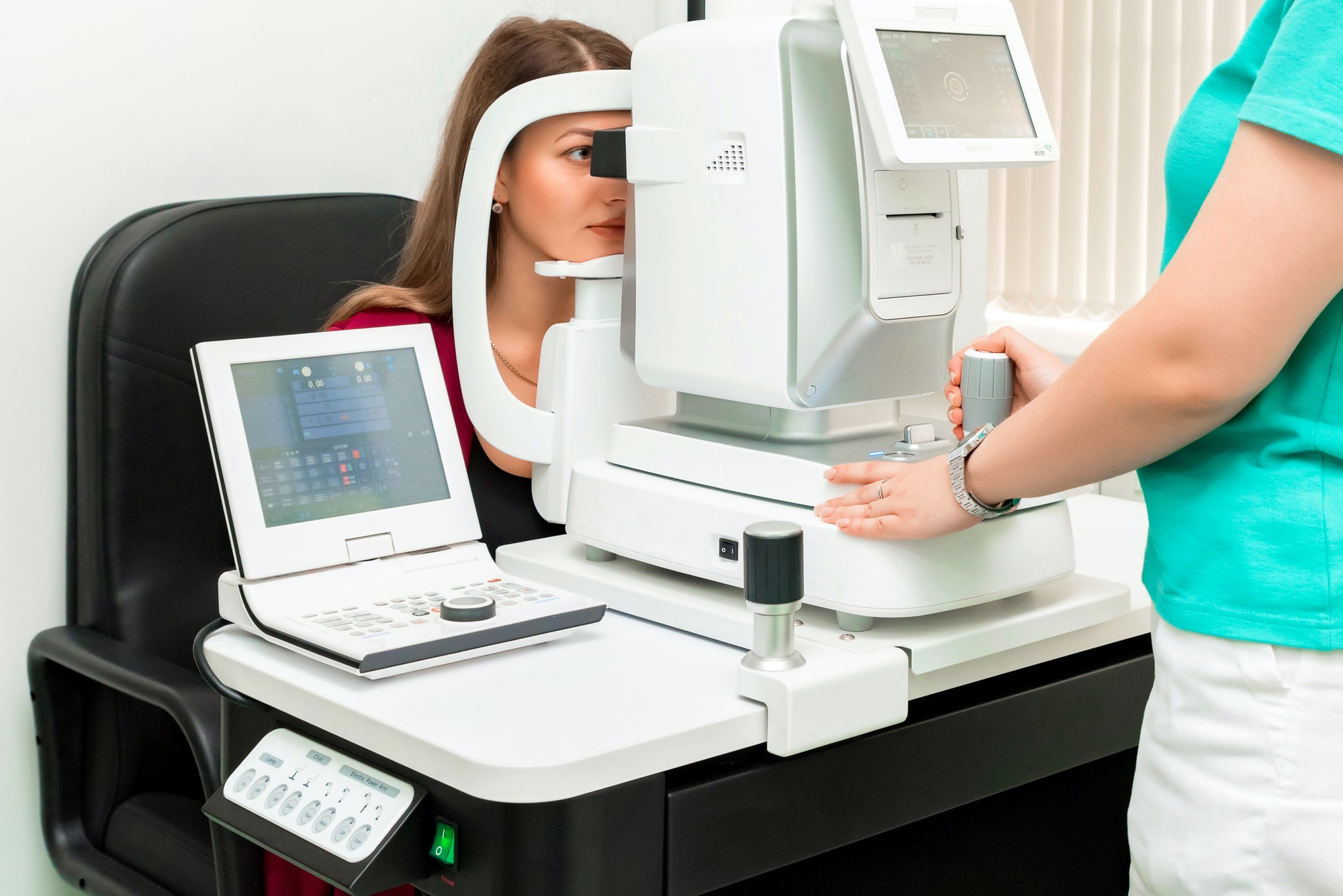 Beautiful woman having an eye lens exam