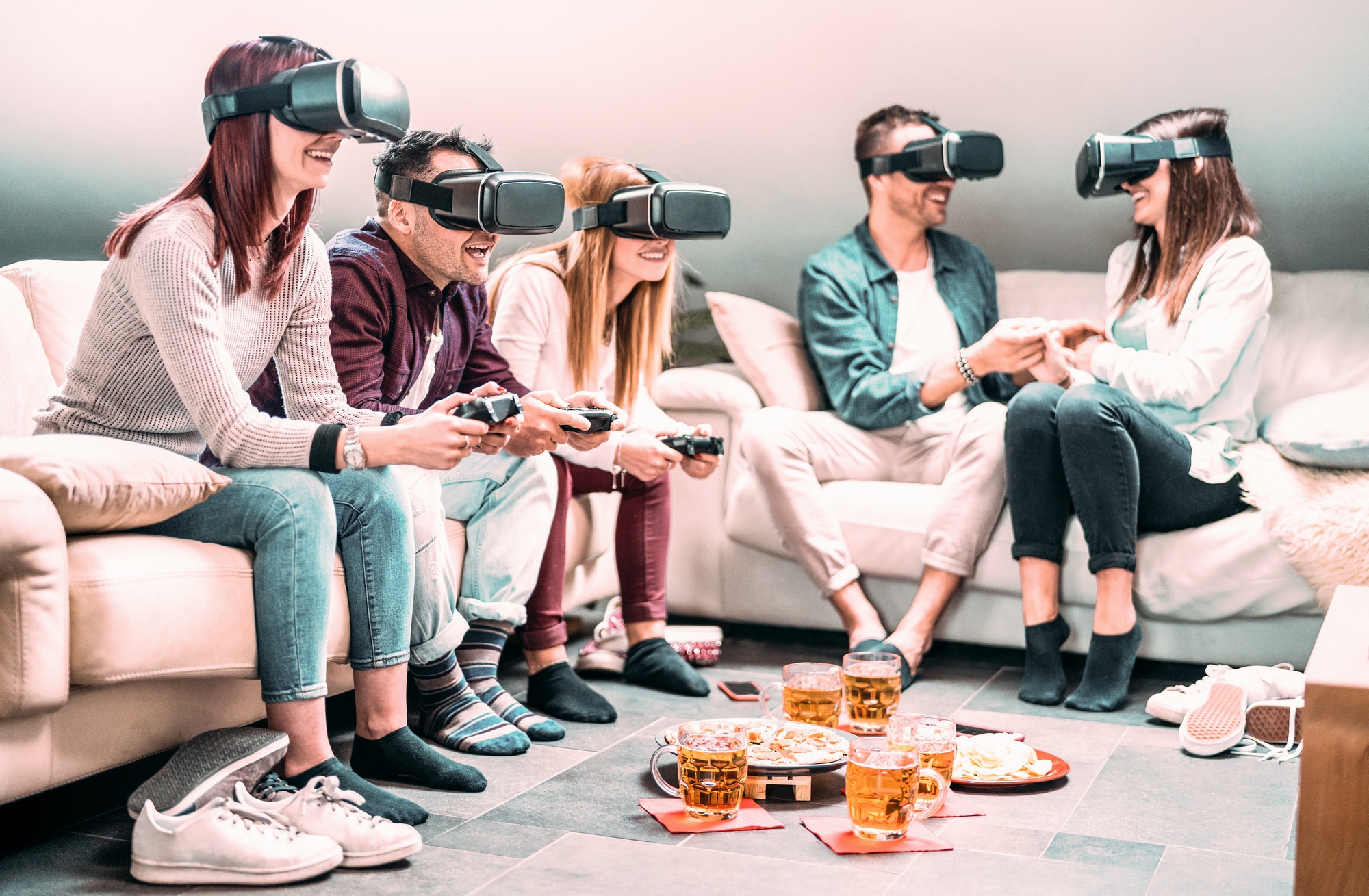 Friends playing with vr headset at home