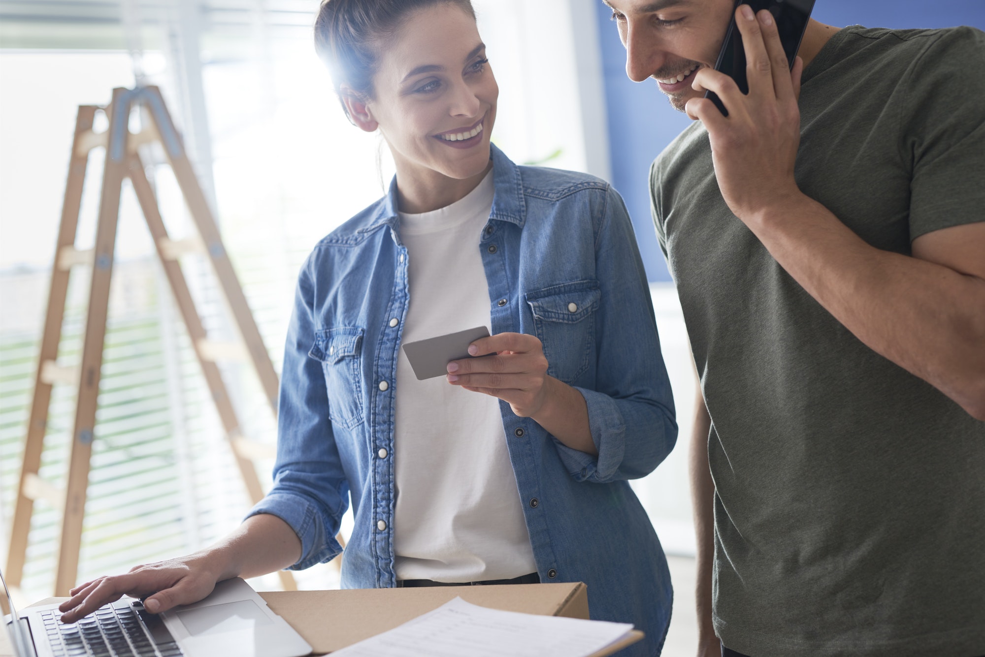 Couple making a call to a bank