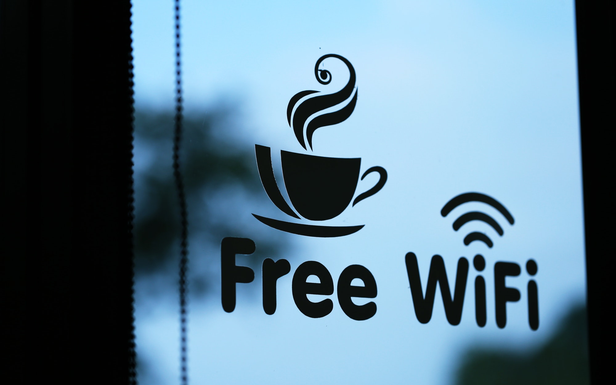 Free wifi and coffee cup stickers label in window glass background