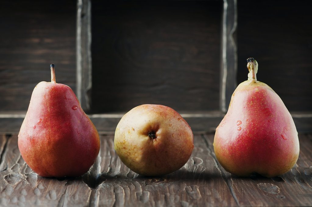 Red sweet pears on the vintage table