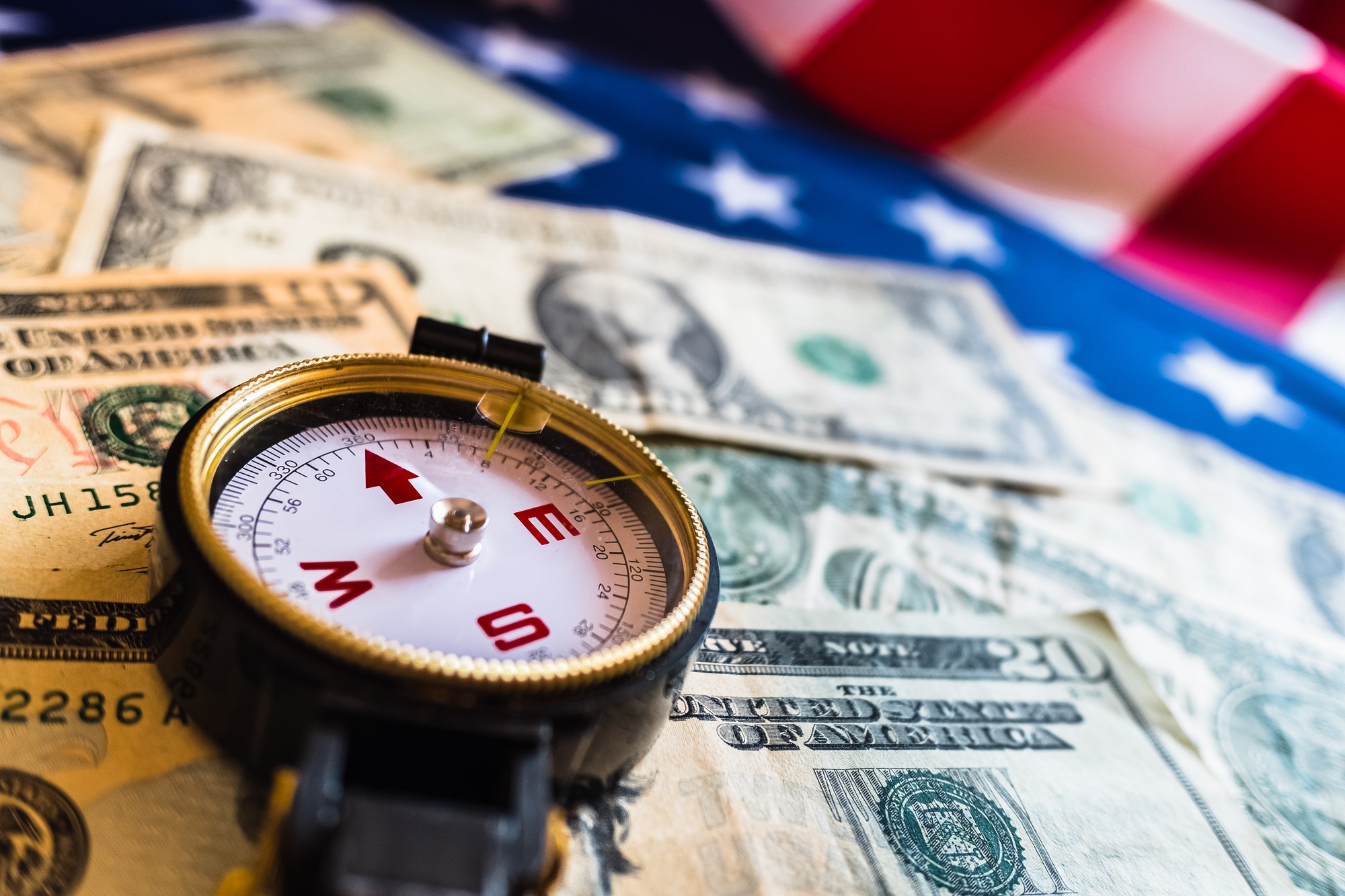 Compass indicating economic problems before a dollar crisis.